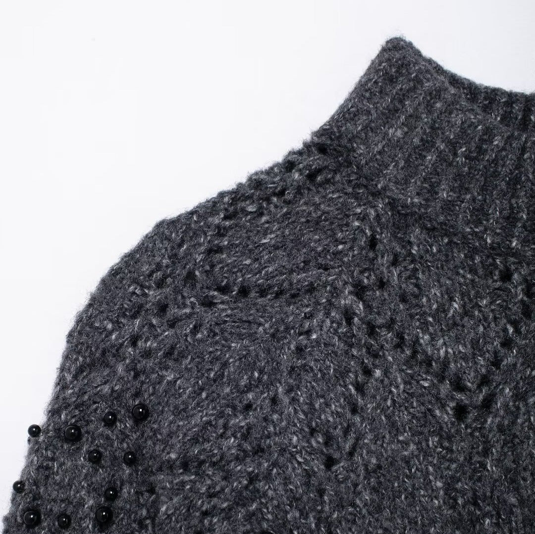 Women's gray asymmetrical knit sweater - side view showing unique cut