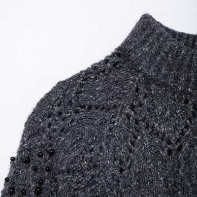 Women's gray asymmetrical knit sweater - side view showing unique cut
