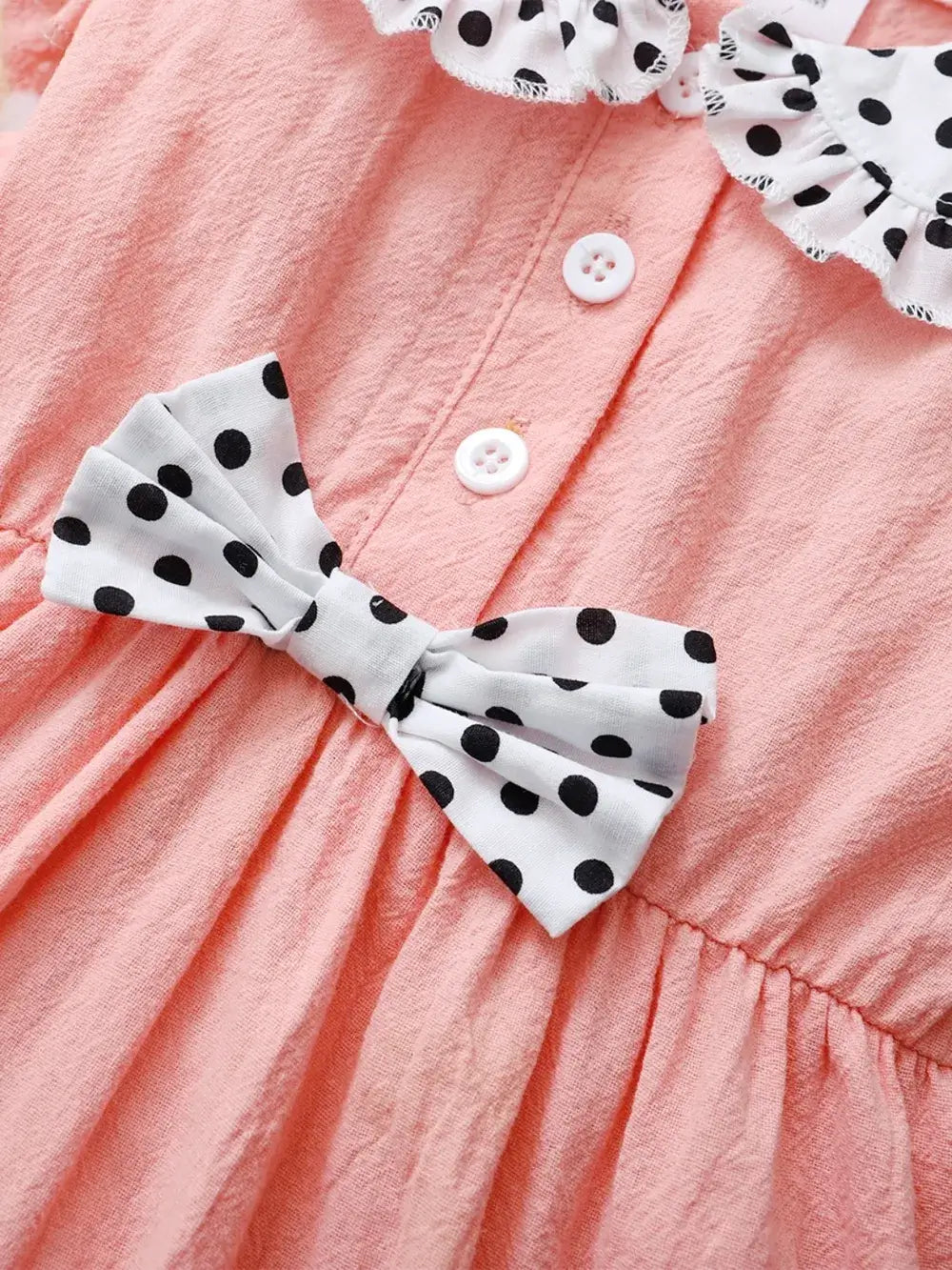 Children's Bow Peter Pan Collar Ruffle Sleeve Dress featuring a polka dot bow and ruffled collar detail.