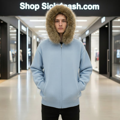 Person wearing a light blue hoodie with a fur-lined hood in a mall setting, with 'Shop Sickcash.com' sign above.