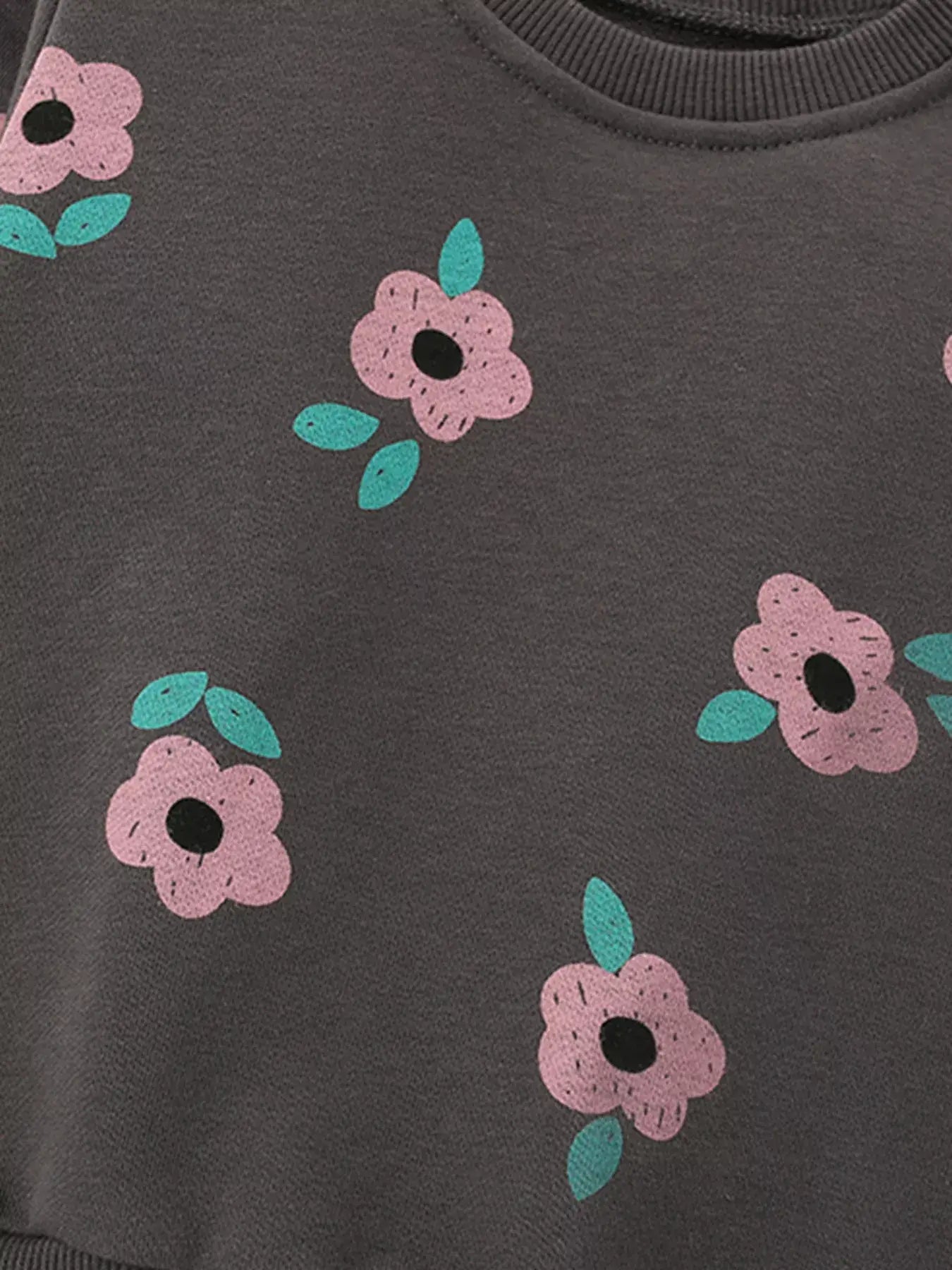 Children's Floral Print Crew Neck Sweatshirt with pink flowers and green leaves on a dark background.