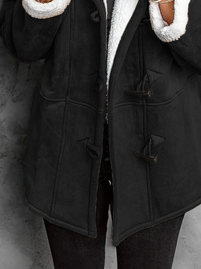 "Black sherpa toggle coat with hood on neutral background"
