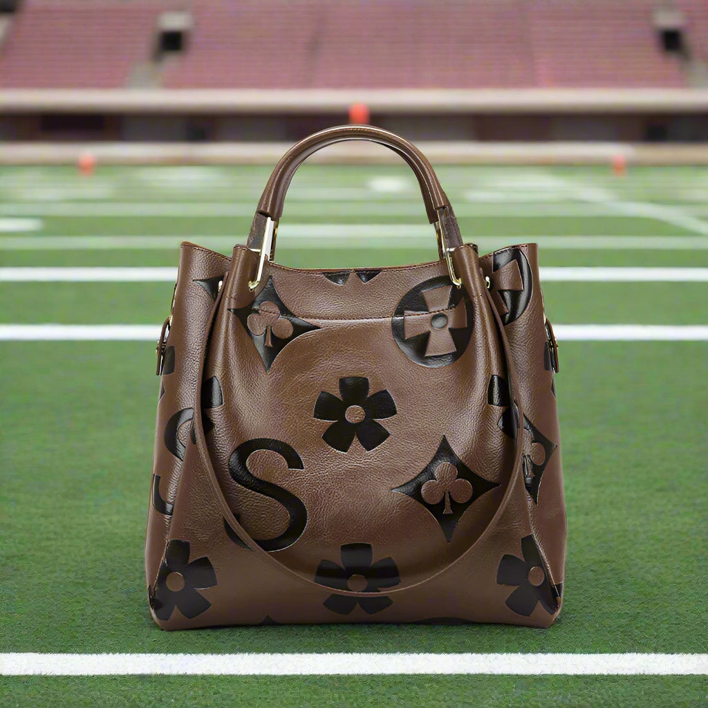 Brown handbag with floral patterns