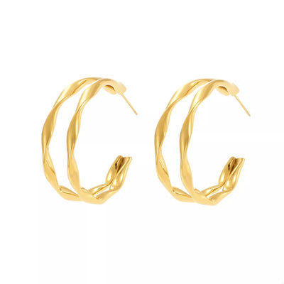 Gold hoop earrings on a white background