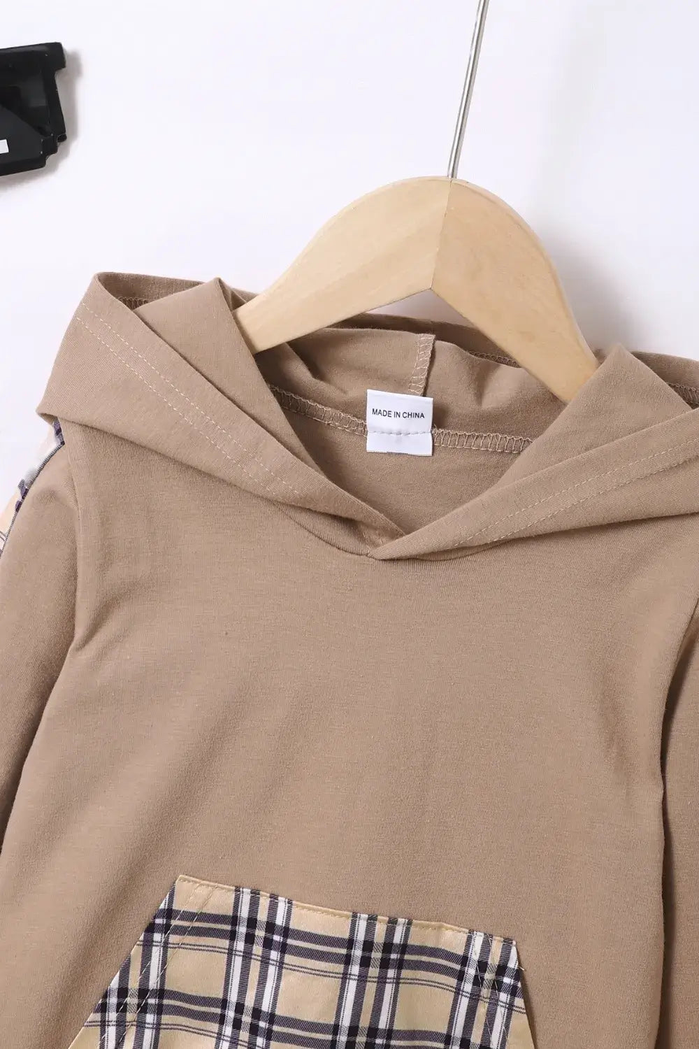 Children's Plaid Hoodie and pants Set close-up, featuring hood and pocket detail on beige fabric.