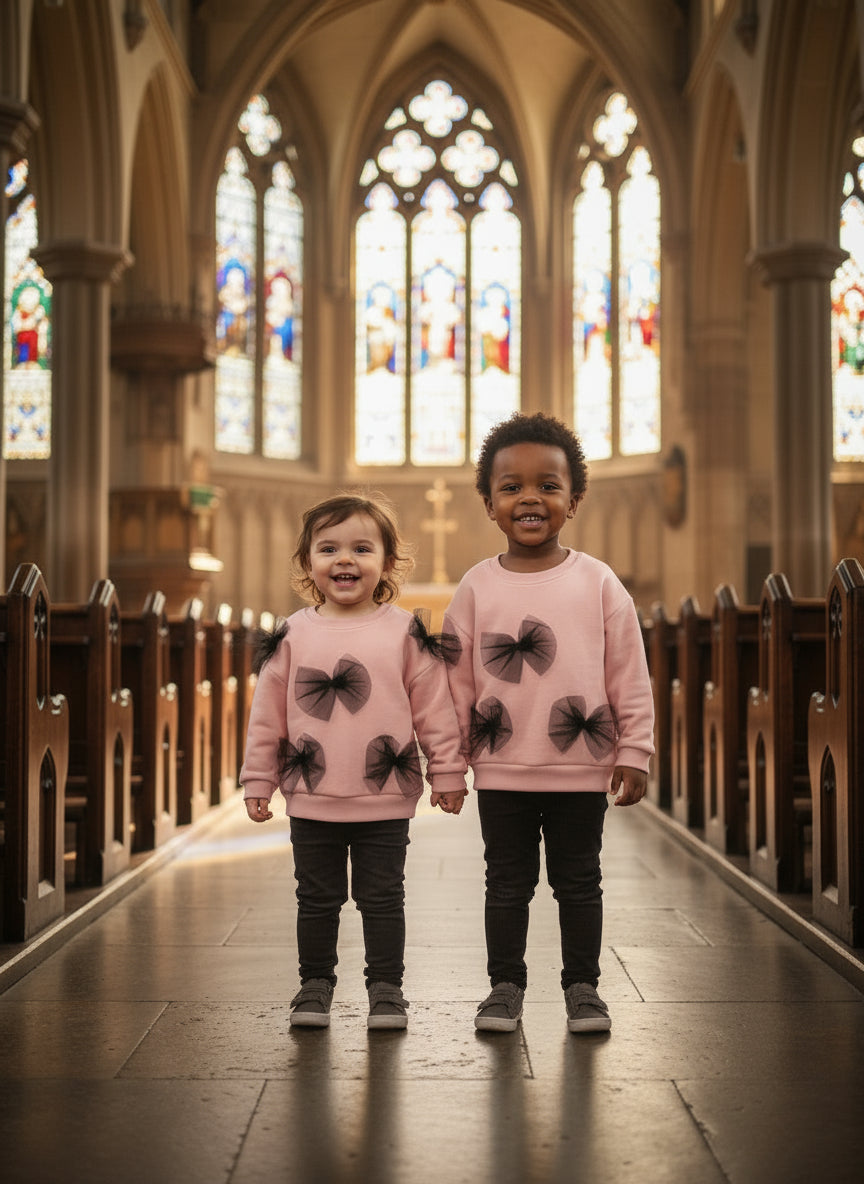 Kid Pink sweater with black bow 