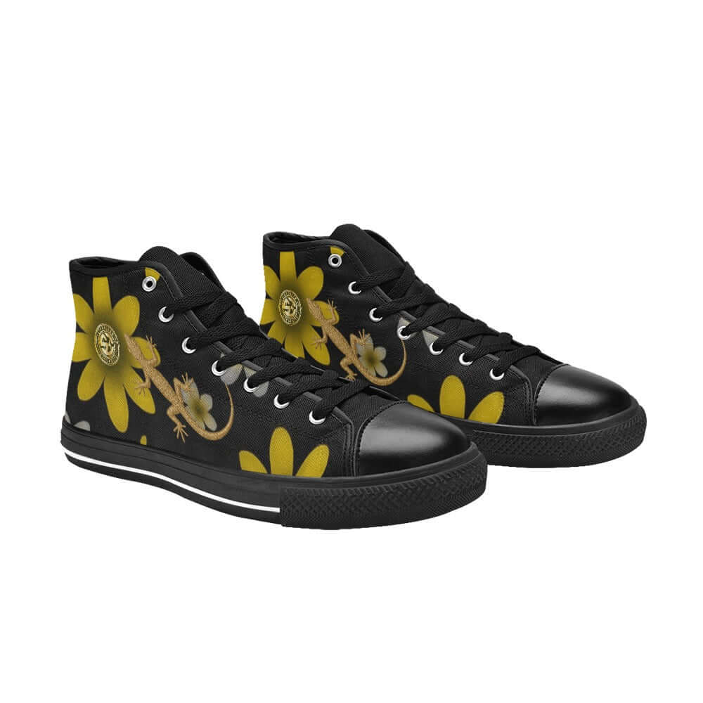 Black sneakers with yellow floral and lizard designs on a white background