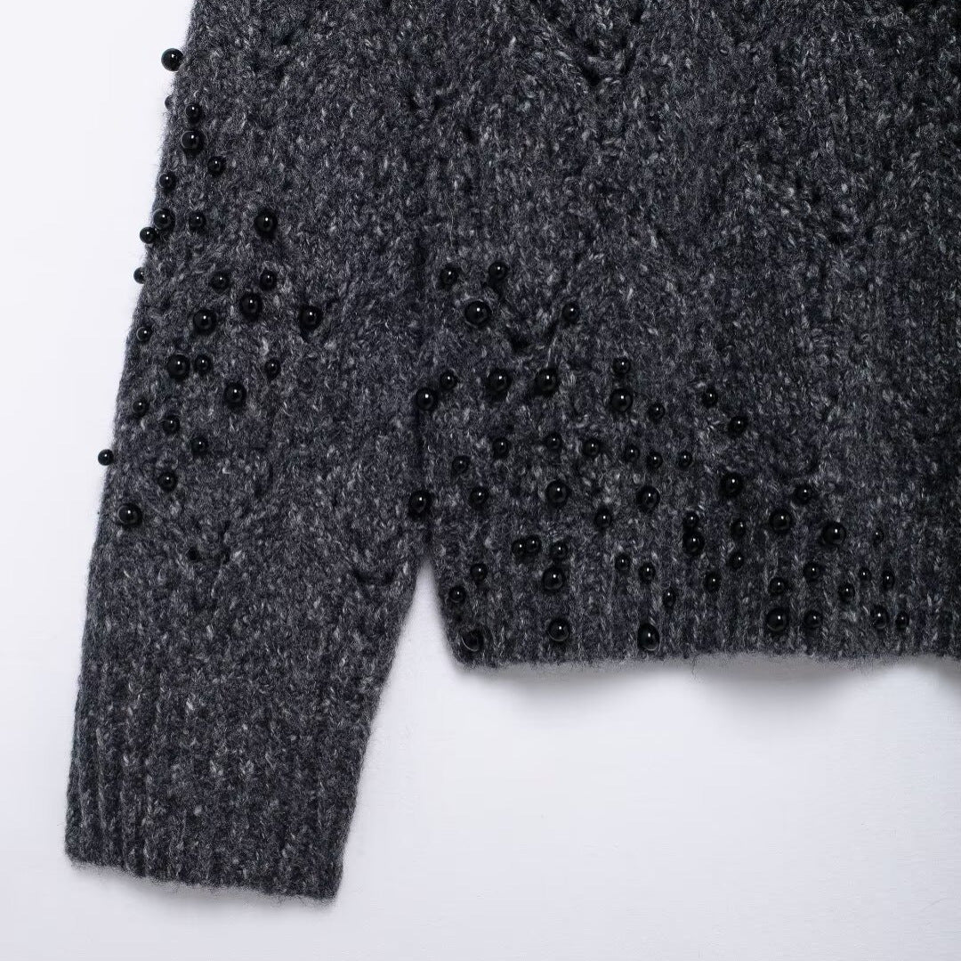Women's gray asymmetrical knit sweater - close-up of knit texture and details