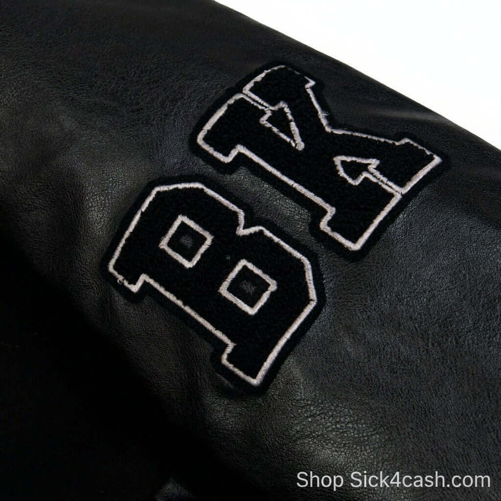 SICK4CASH Embroidered patchwork jacket baseball jacket detail featuring embroidered letters BK on sleeve.