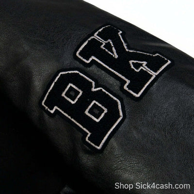 SICK4CASH Embroidered patchwork jacket baseball jacket detail featuring embroidered letters BK on sleeve.