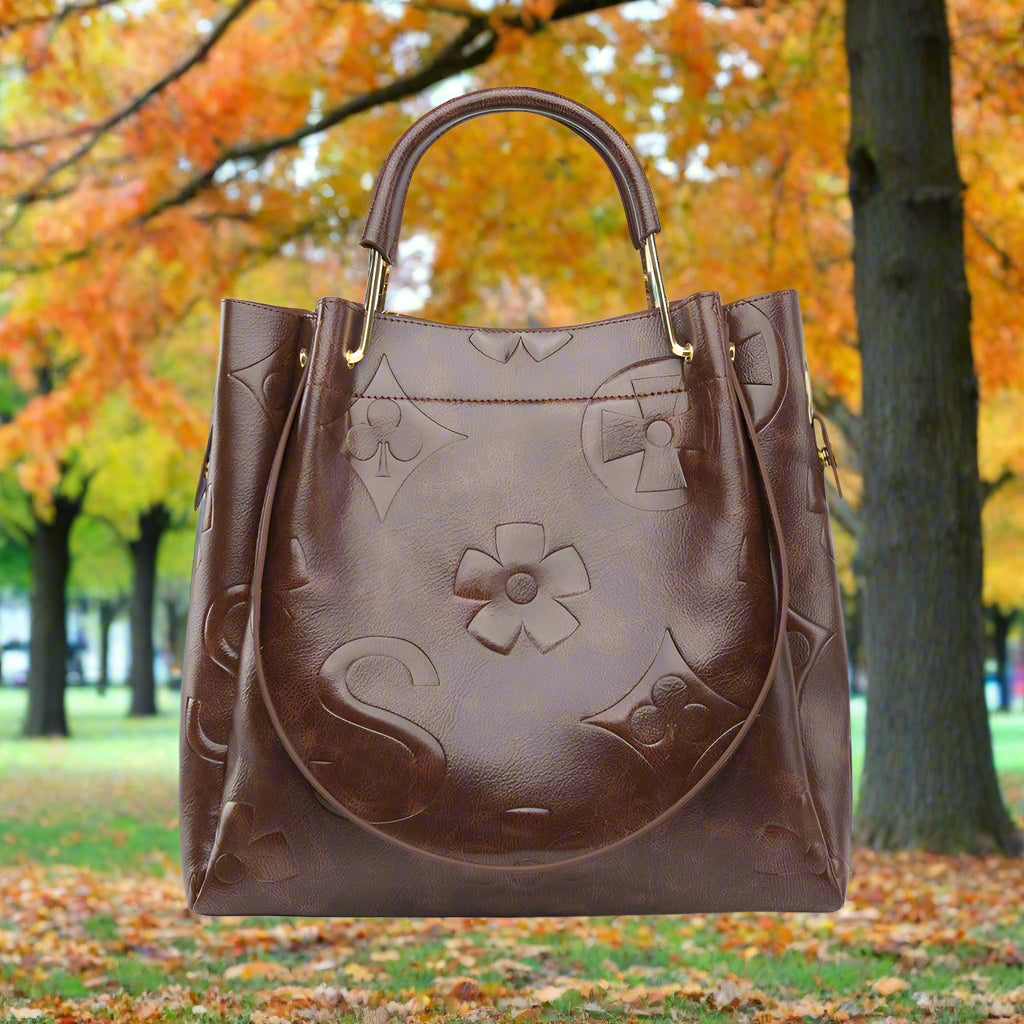 Brown leather handbag with floral