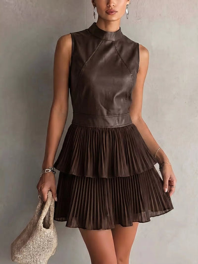 Sleeveless Faux Leather Look Pleated Mini Dress in brown with layered pleats and seam detailing, perfect for a chic outfit.