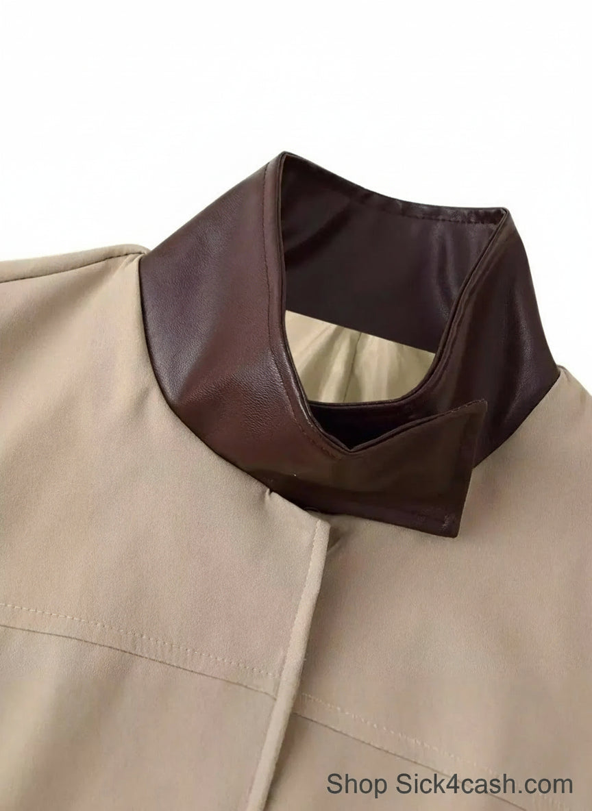 Close-up of a beige coat with a brown collar on a white background