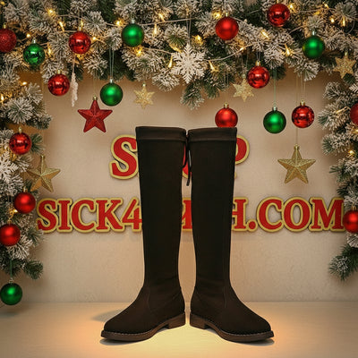 Black knee-high boot on a white background