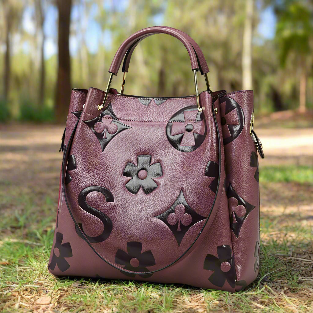 Purple handbag with floral patterns