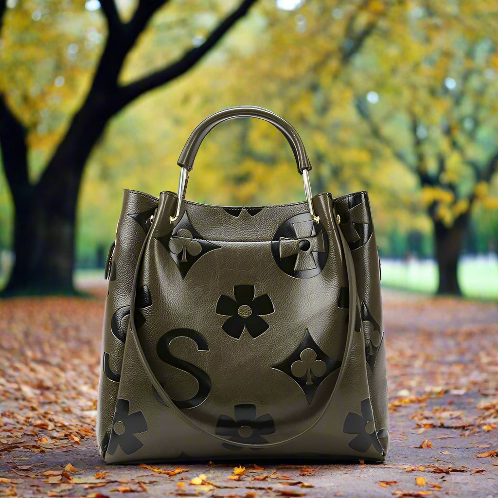 Green handbag with floral patterns