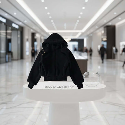Black hoodie on a white pedestal in a blurred mall setting with 'shop sick4cash.com' text.