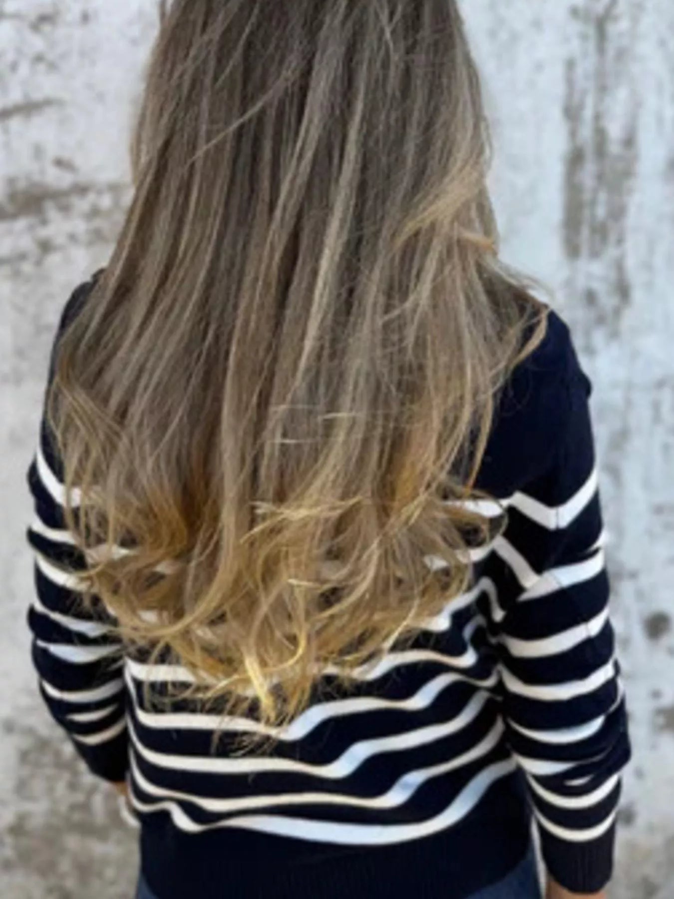 Person wearing a black and white striped sweater