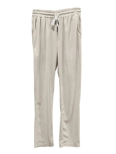 Beige pants with a drawstring on a white background