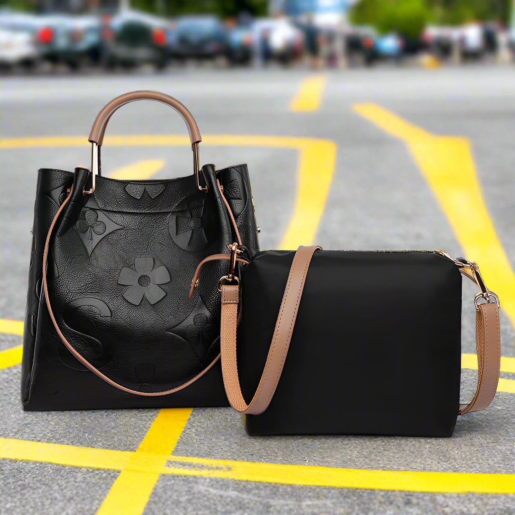 Black handbags with brown straps on