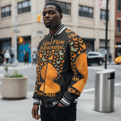Man wearing a colorful jacket with text and graphics on a city street