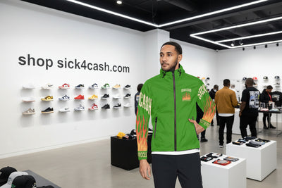 Green jacket with flame design and text on sleeves, worn by a person.