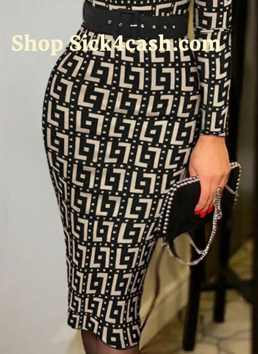 Person wearing a black and white patterned dress with a belt, holding a black clutch.