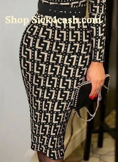 Person wearing a black and white patterned dress with a belt, holding a black clutch.