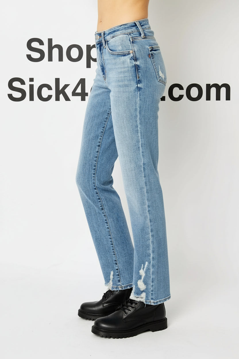 Light blue jeans worn by a person on a white background