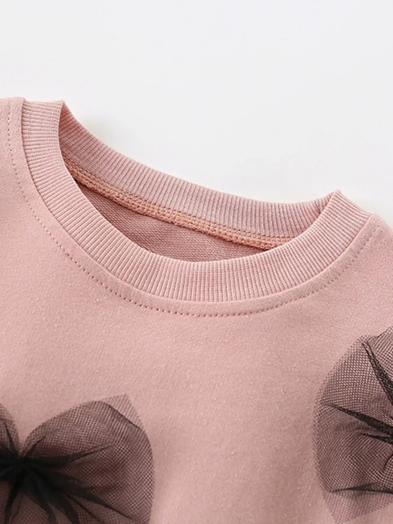 KID pink garment with black floral