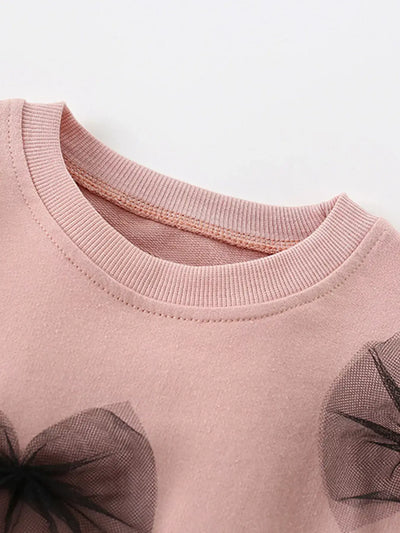 KID pink garment with black floral