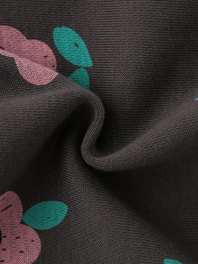 Close-up of fabric showing Children's Floral Print Crew Neck Sweatshirt with floral design and ribbed texture.