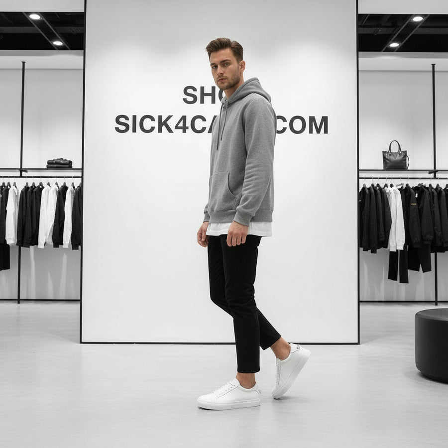 White sneaker on a dark surface with a light gray background